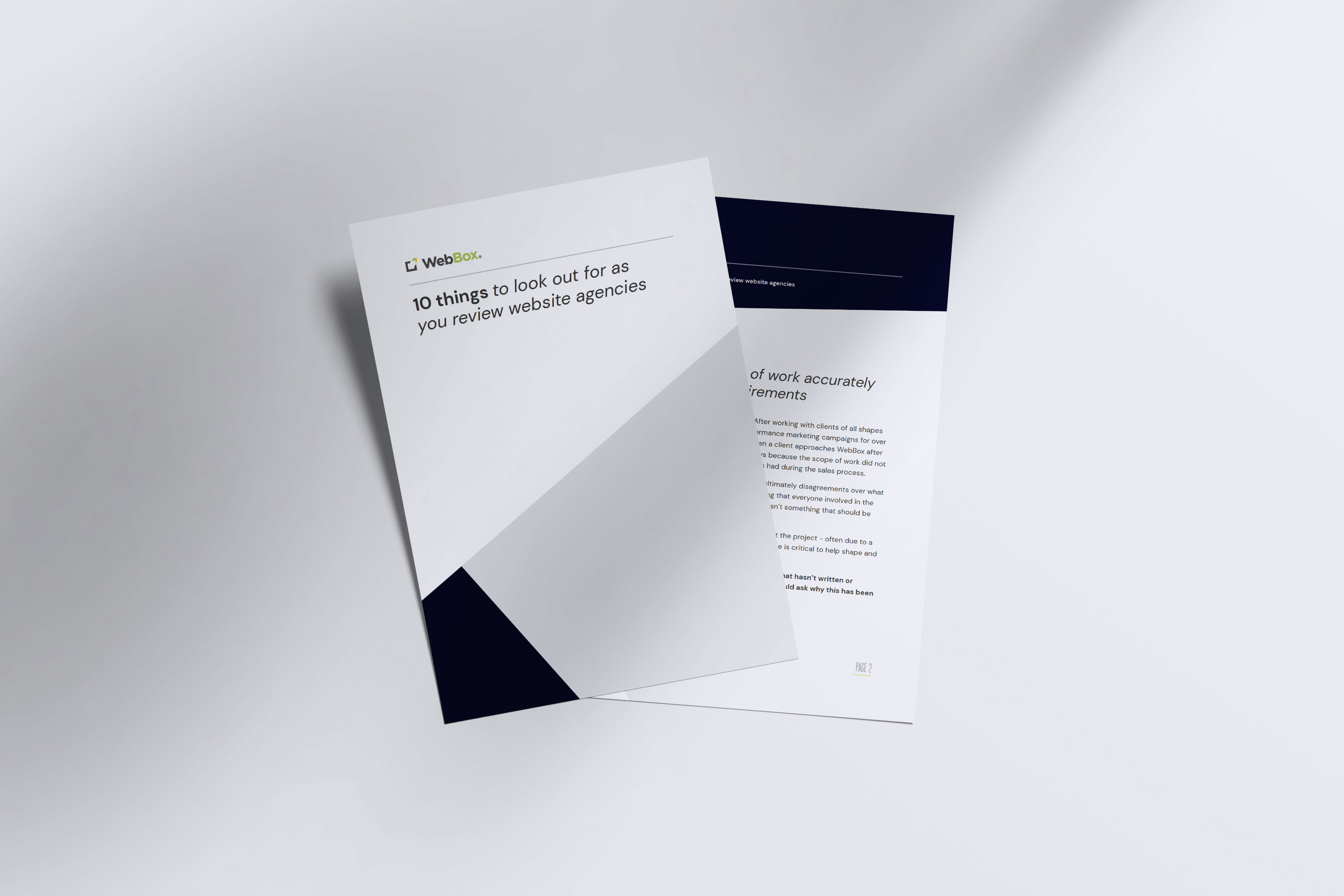 Two printed booklets are displayed on a white surface. One booklet's cover reads "10 things to look out for as you review website agencies," while the other booklet is open, showing text on its pages.