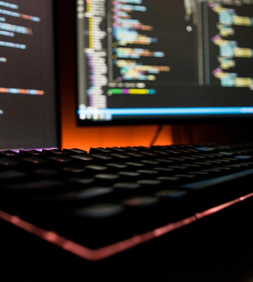 Picture of a computer with coding on screen