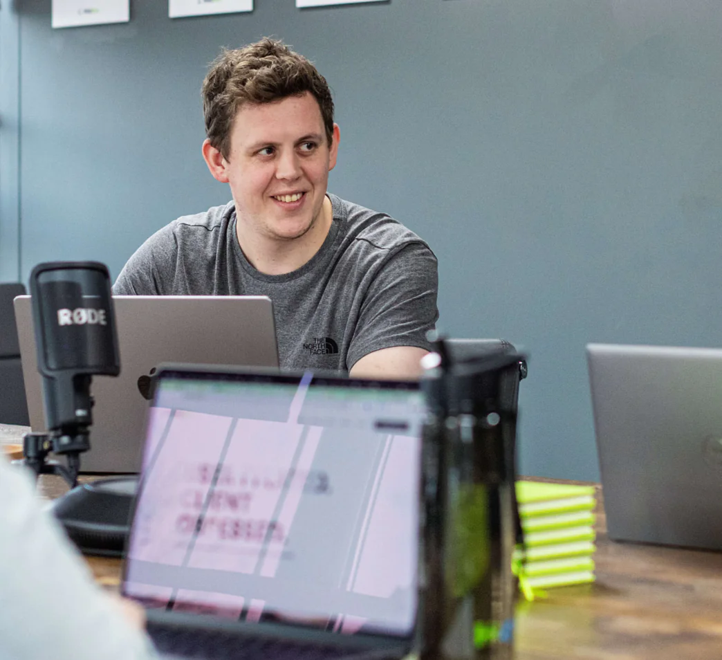 Man smiling in a meeting